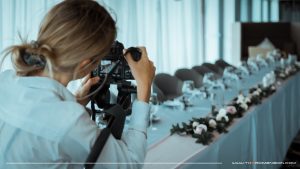 videographer filming bridal table