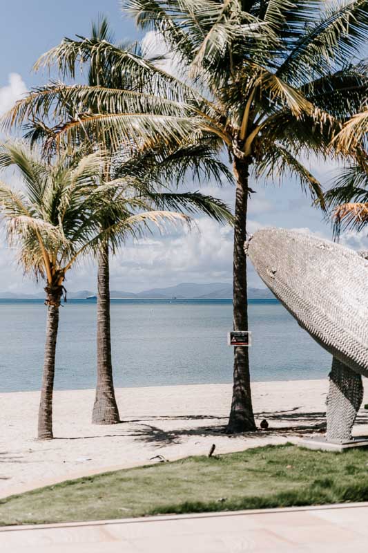 Hayman Island beach with whale sculpture