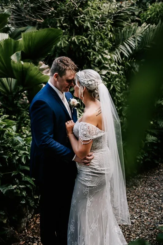 bride and groom in rainforest