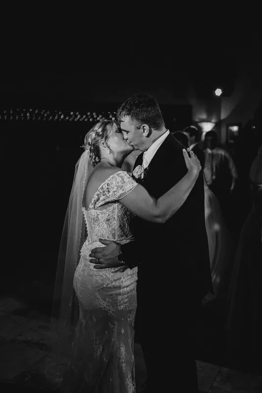 bride and groom first dance kissing