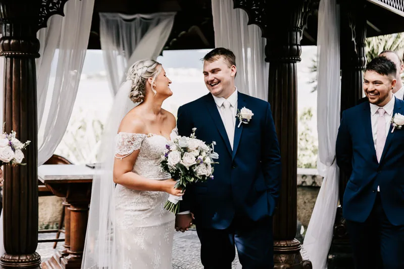 bride and groom looking eachother