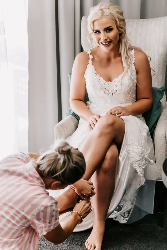 bride putting on shoes