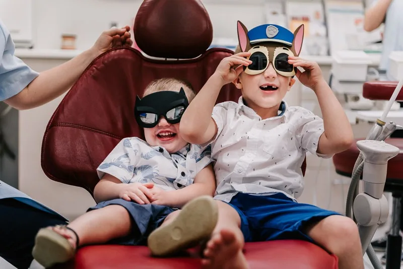 two kids in dentist chair