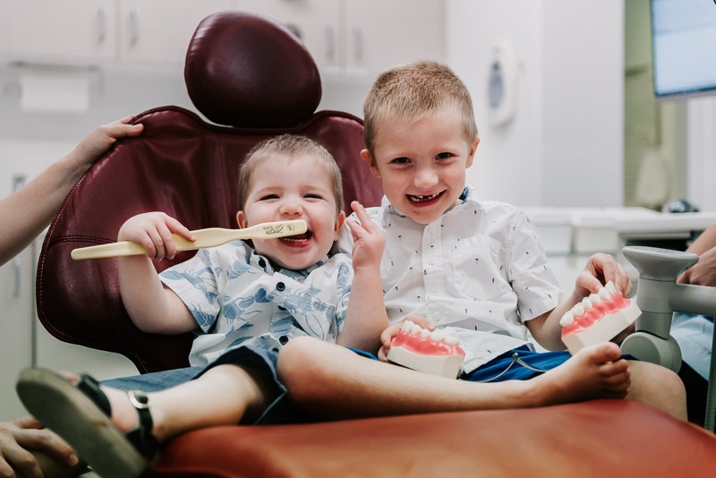 two kids in dentist chair