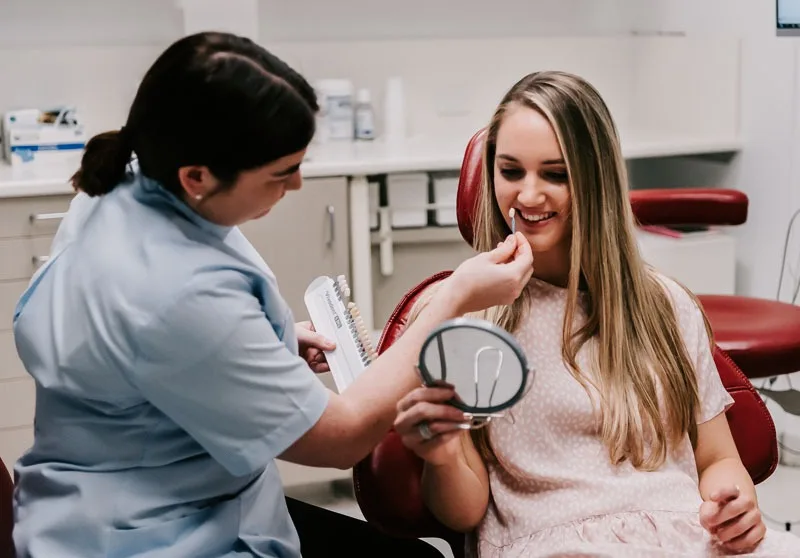dentist smiling with dentist patient
