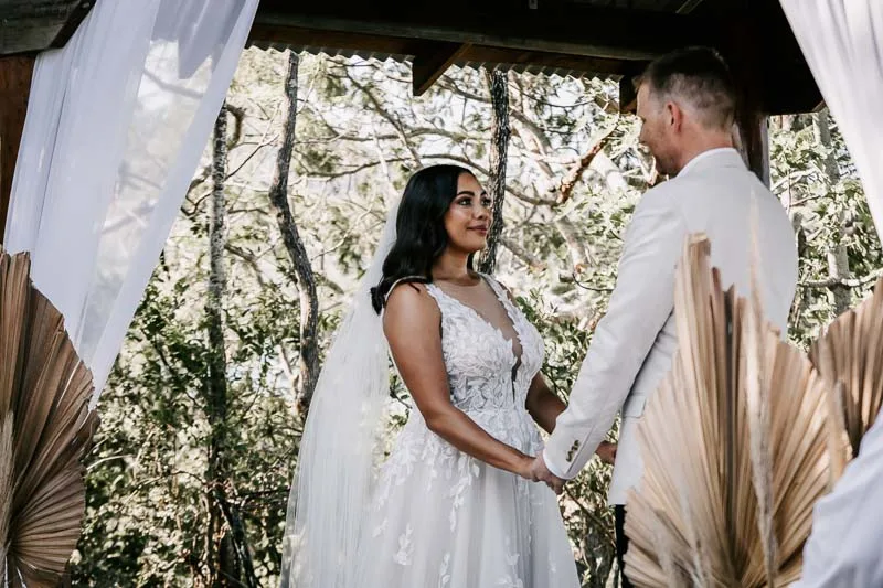 bride and groom at alter
