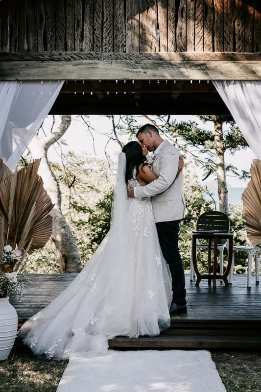 bride and groom kiss