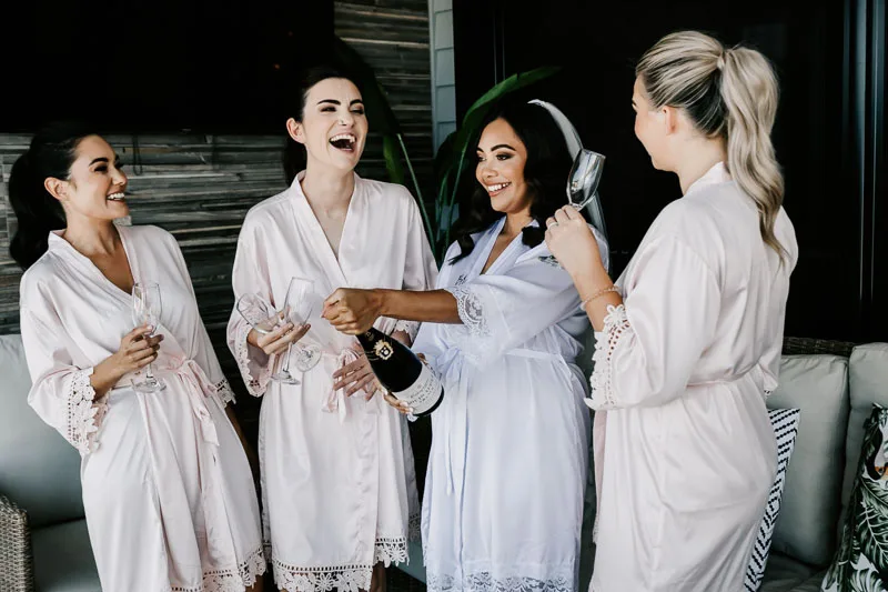 bride and bridesmaids in robes
