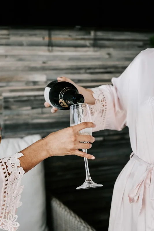 bride puring champagne