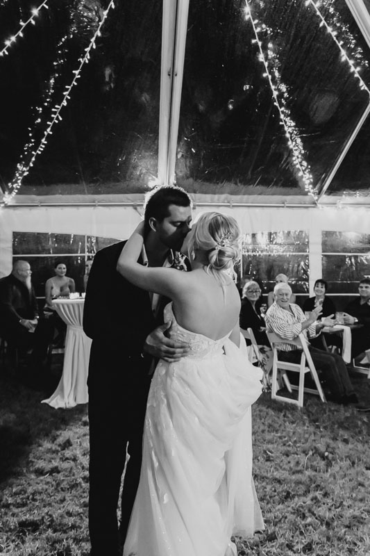 bride and groom kiss on the dancefloor