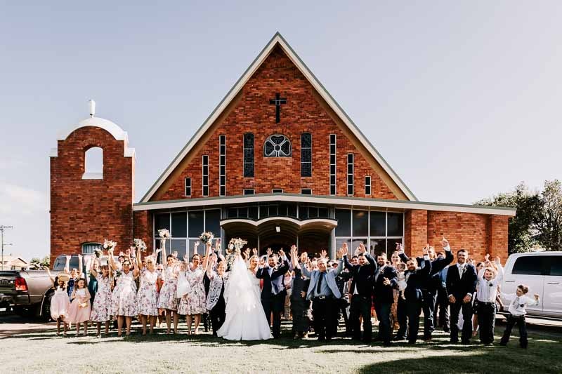 wedding group photo infront of church