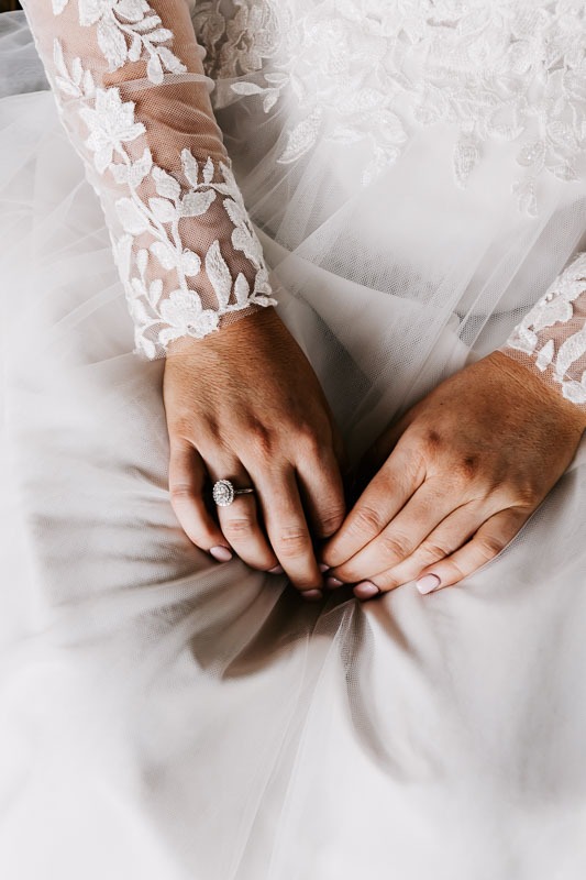 brides hands in lap