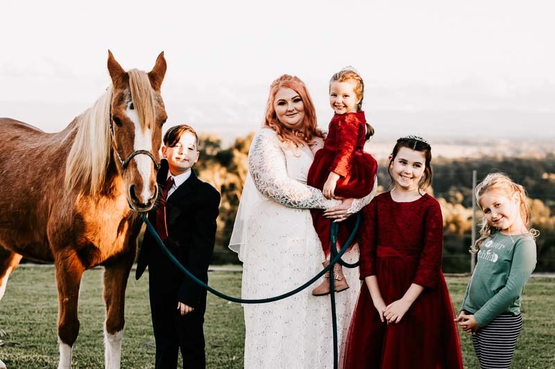 bride and children with horse