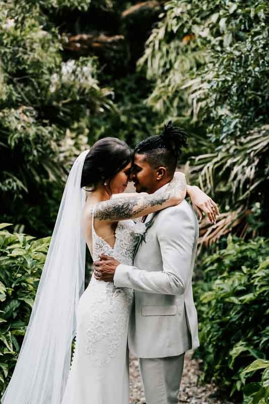 bride and groom in rainforest