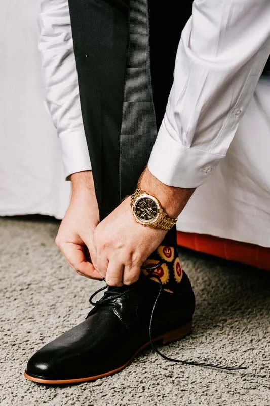 groom tying shoe laces