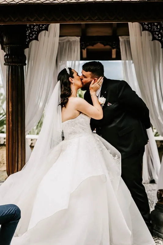 bride and groom kiss