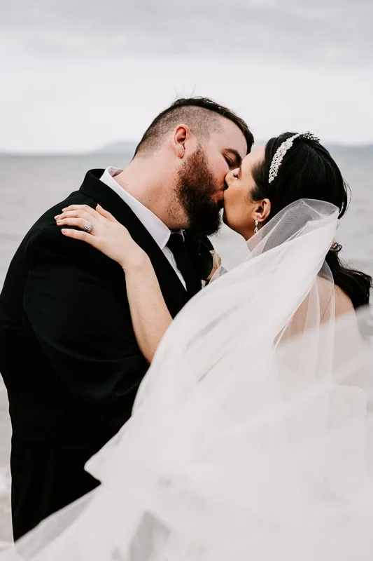 bride and groom kiss