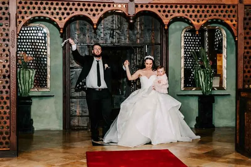 bride, groom and daughter enterance