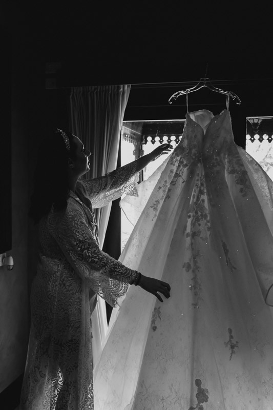 bride inspecting gown