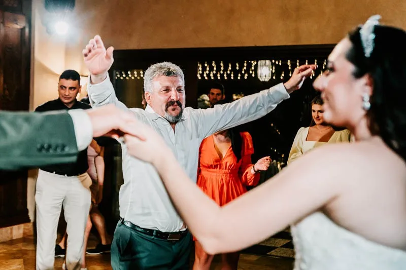 father and bride celebrate in dance