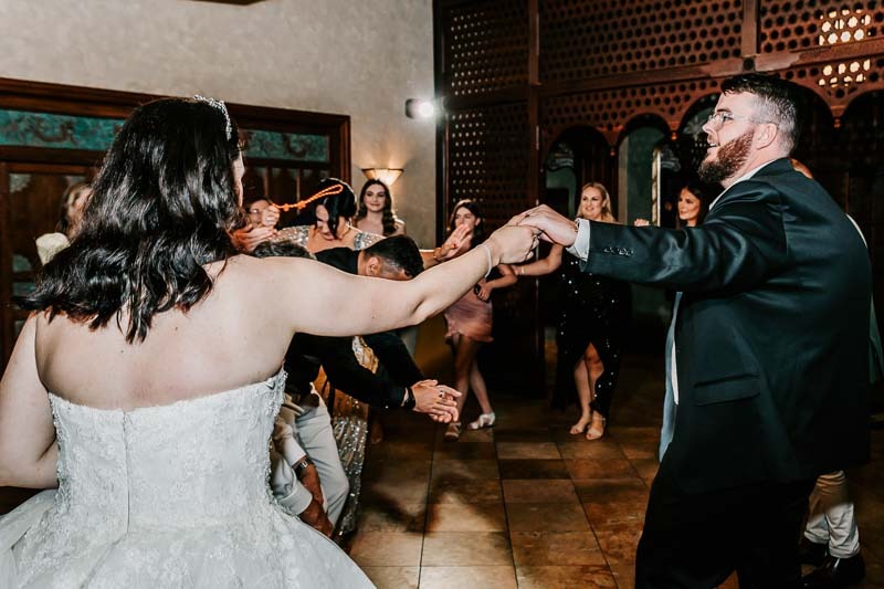 bride and groom celebrate in dance