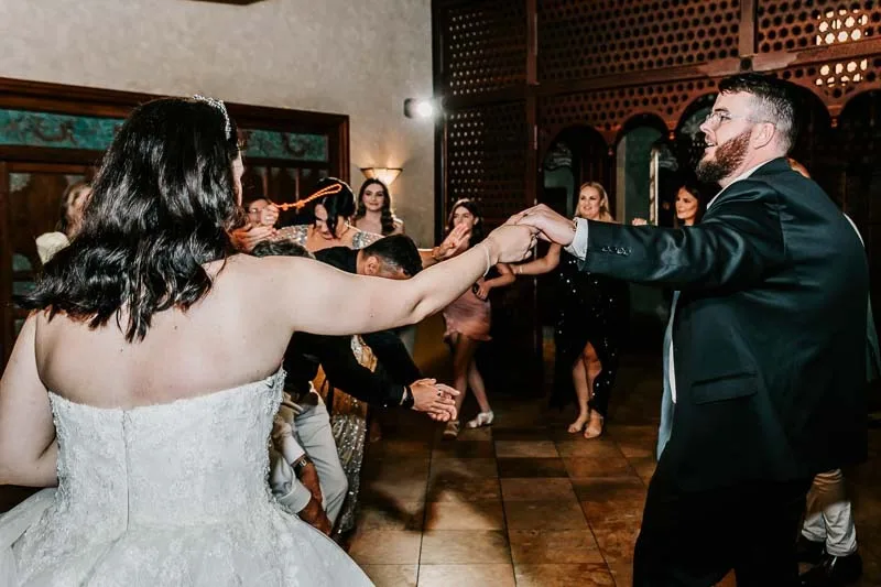 bride and groom celebrate in dance