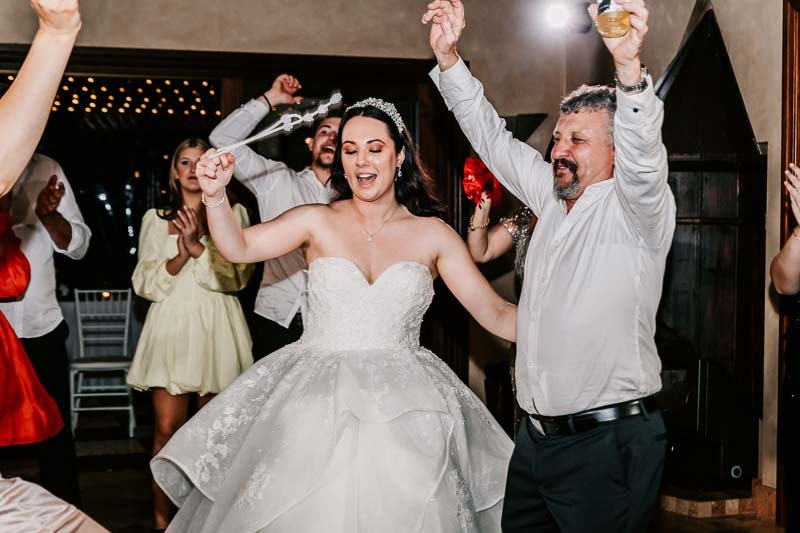 bride and father celebrate in dance