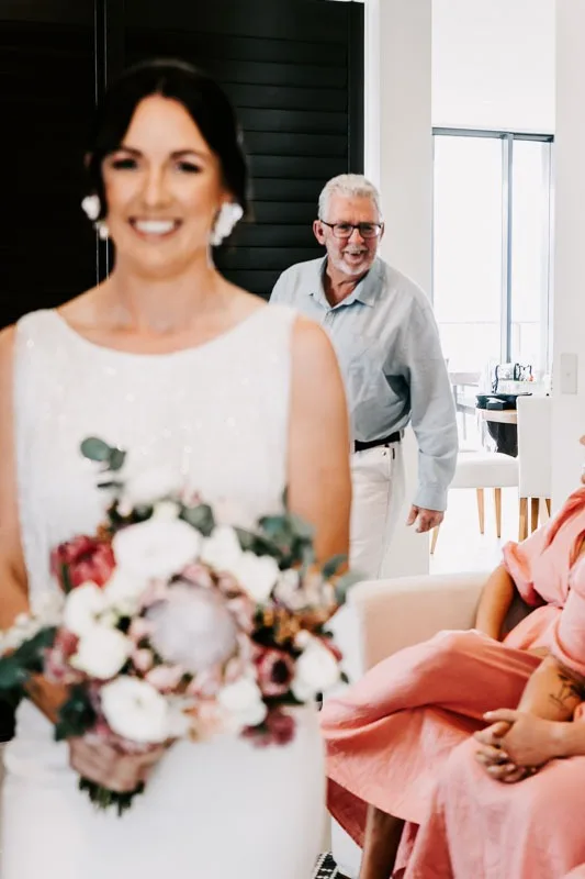 Bride with father behind
