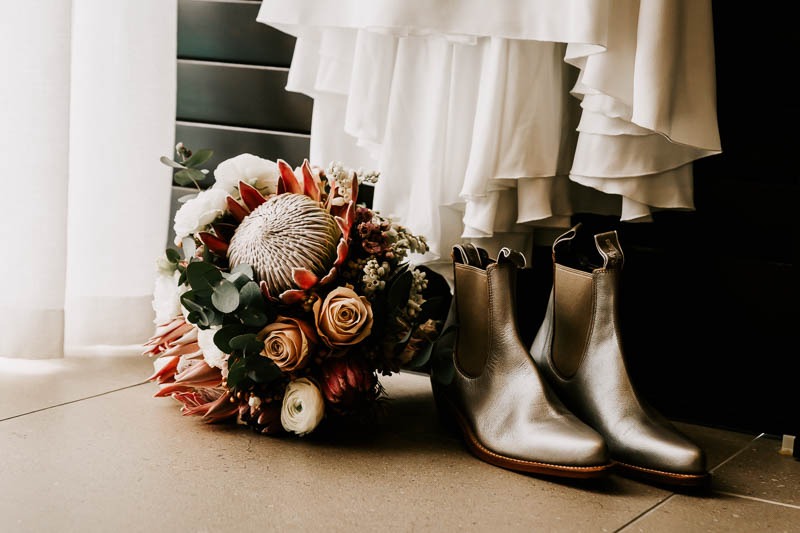 Brides shoes, bouquet and gown