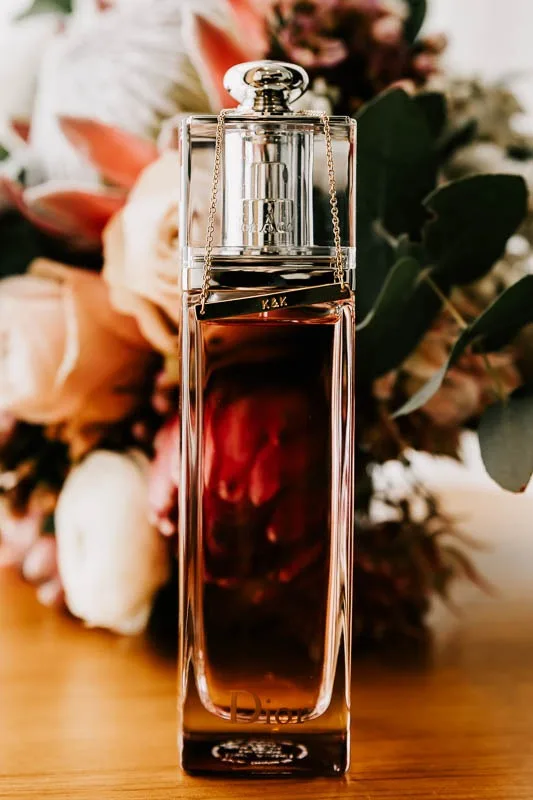 Brides perfume in front of bouquet
