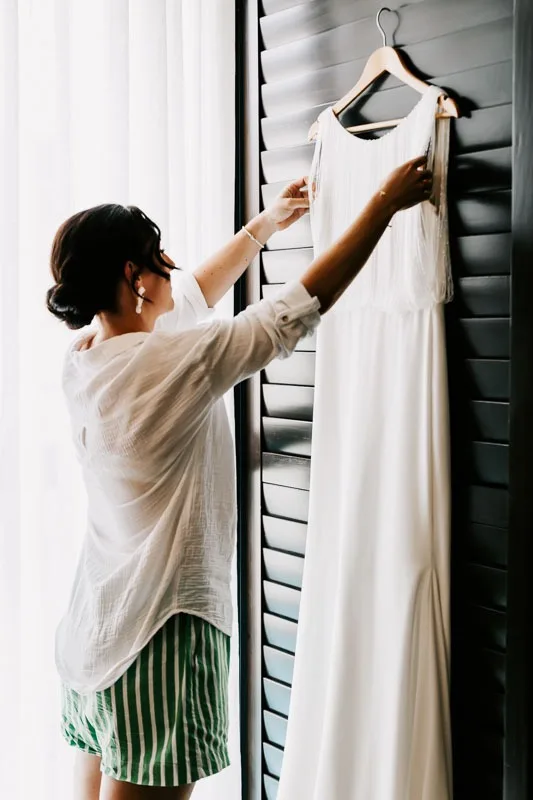 Bride inspecting gown