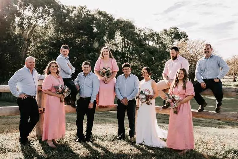 Bride & Groom with bridal party on fence