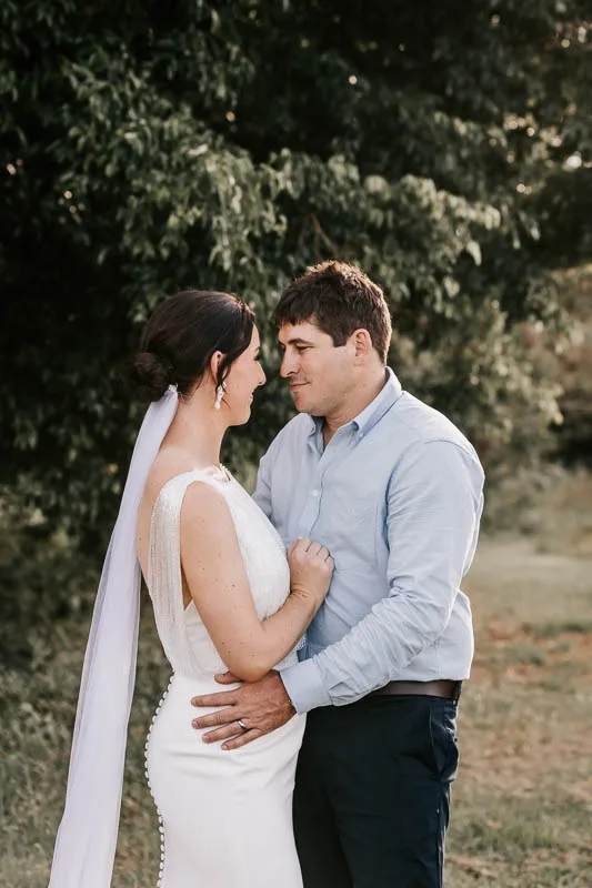 Bride & Groom embrace