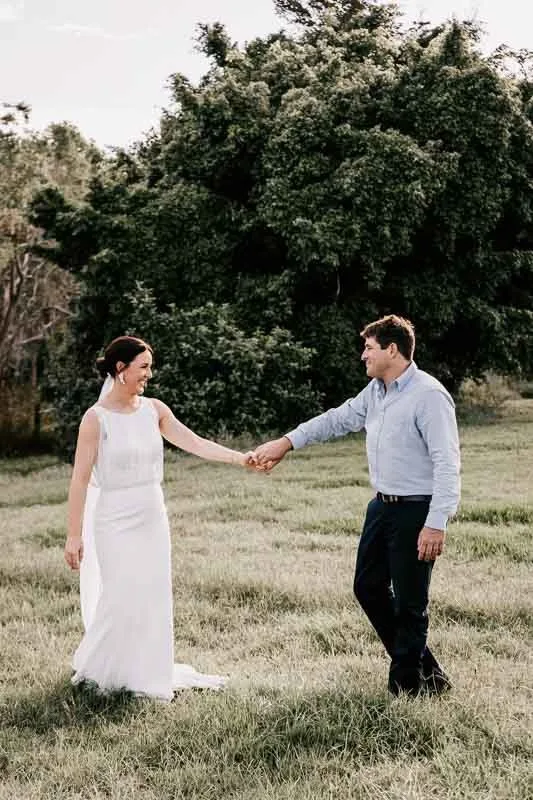 Bride & Groom holding hands