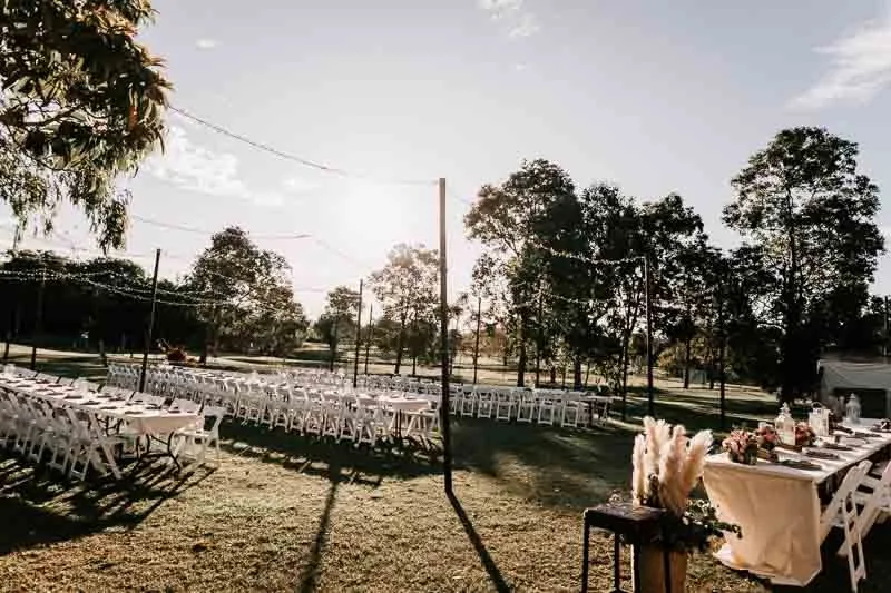 Reception set up with tables, chairs and lights