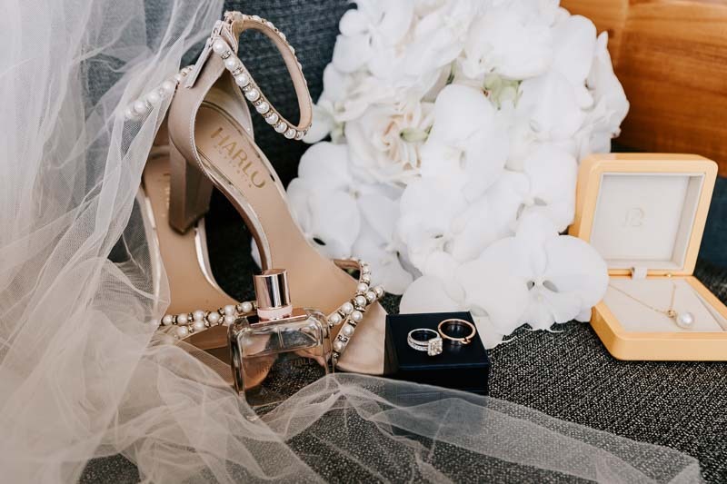 Brides shoes, bouquet, veil and rings