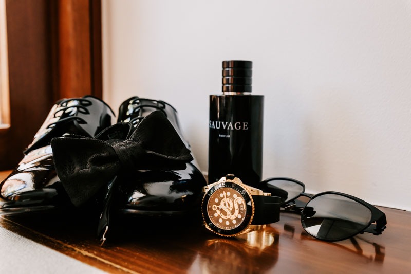 Grooms shoes, watch, perfume and sunglasses
