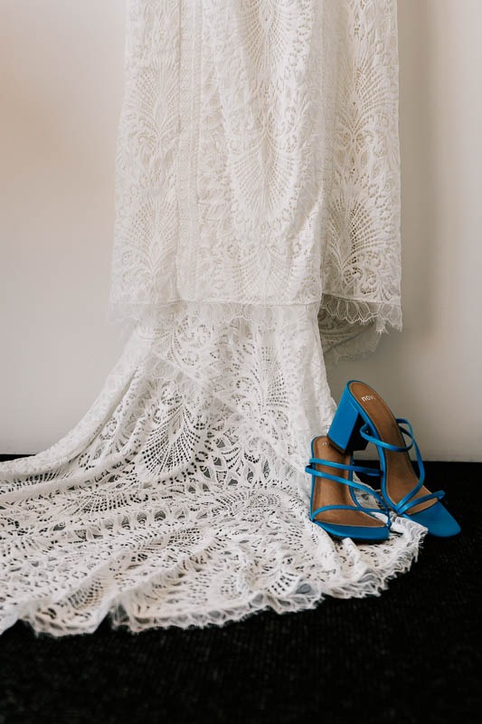 Brides shoes at base of gown