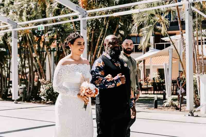 Bride walking down isle with father