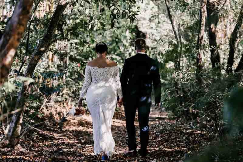 Bride & Groom walk down bush trail