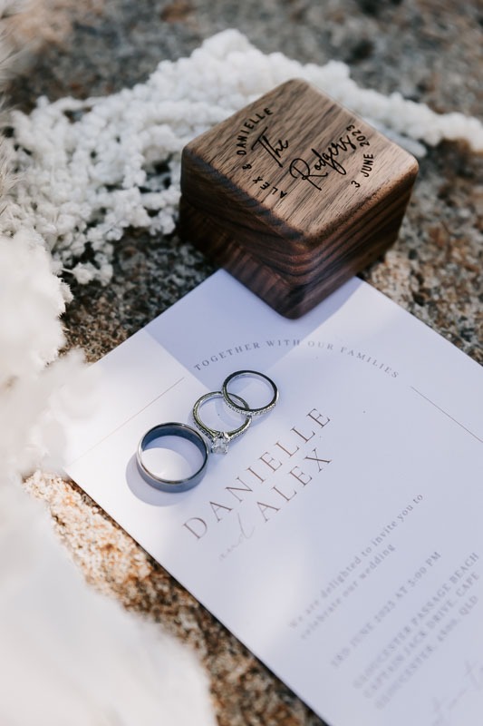 Wedding rings, ring box and invitation