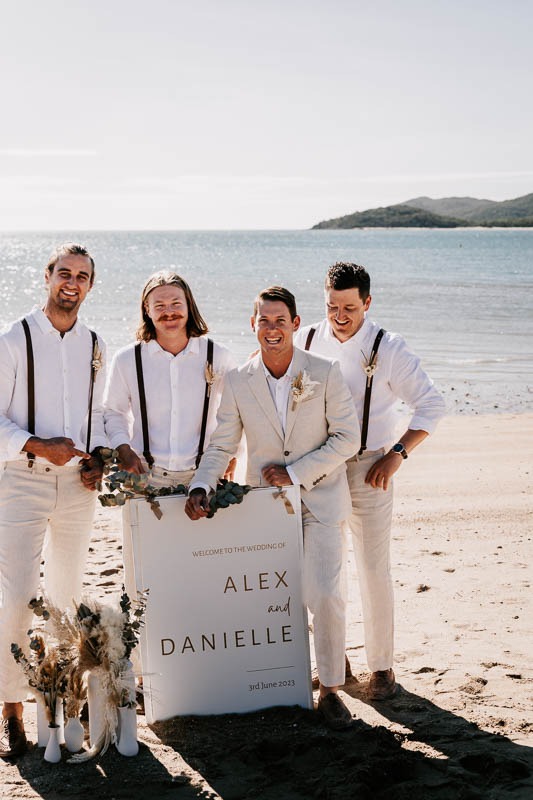 Groom and Groomsmen with welcome sign