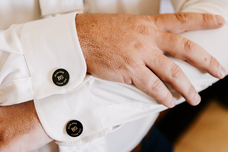 Groom showing name on cuffs