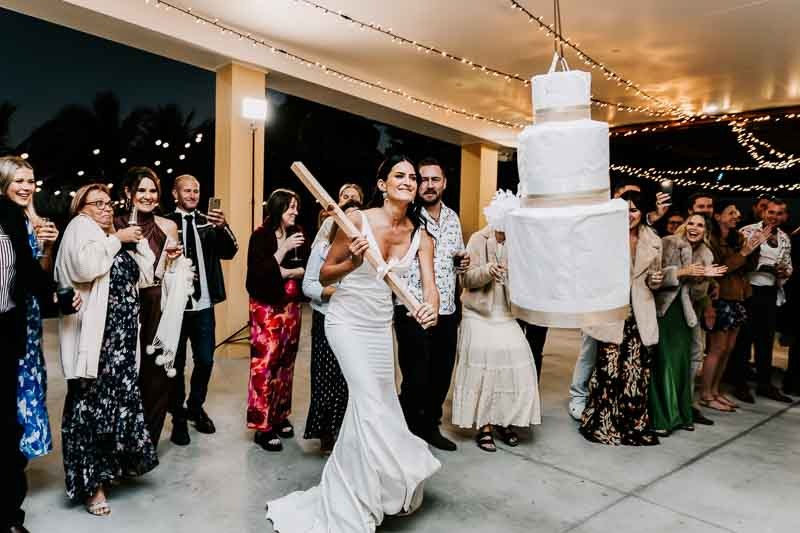Bride smashes cake pinata