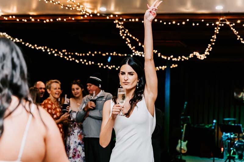 Bride dances with lollies and wine