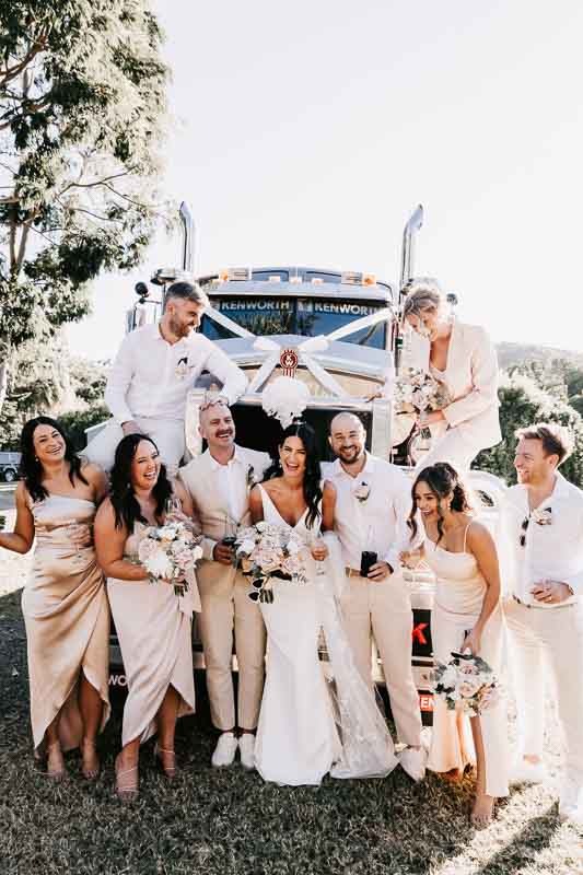 Bride & Groom with bridal party in front of truck