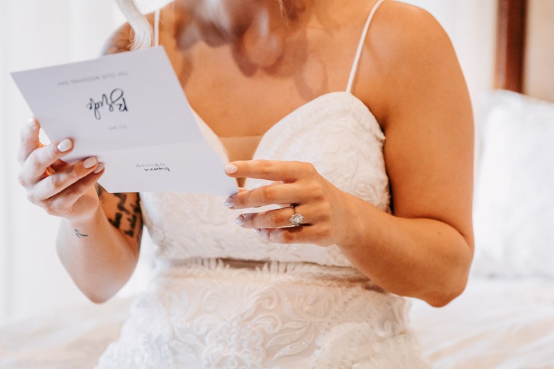 Bride reads letter from groom