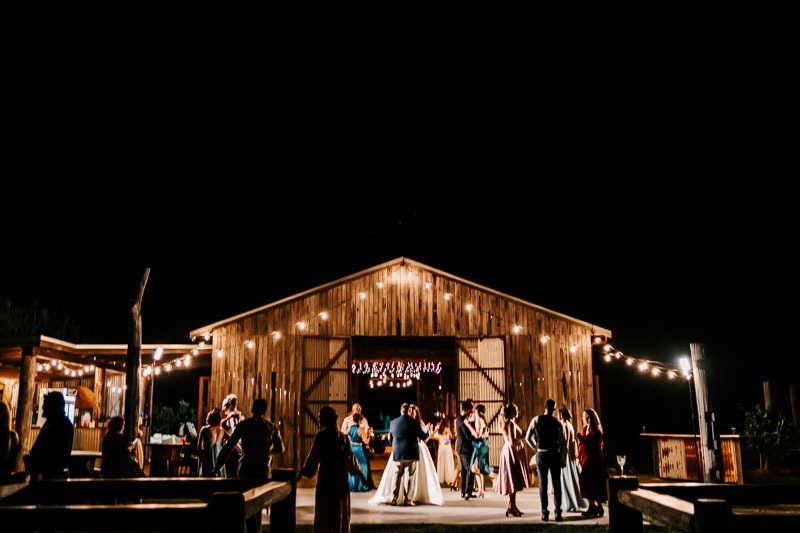 Bride & Groom first dance outside open barn