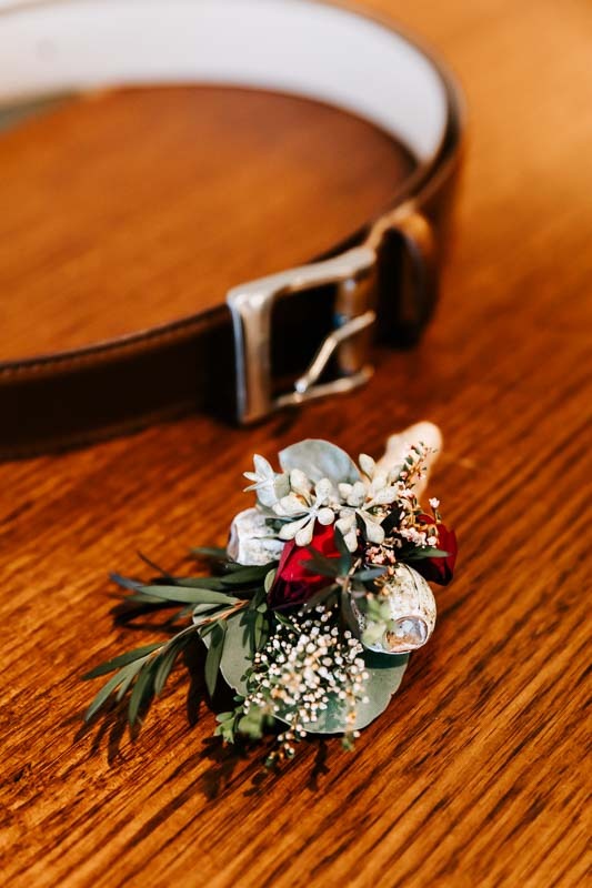 Grooms buttonhole and belt