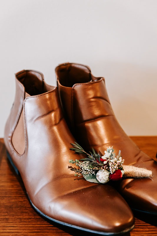 Grooms shoes and buttonhole